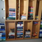 A picture showing 2 bookshelves with books on next to each other